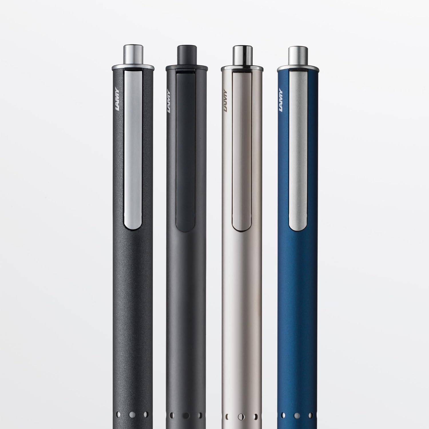 LAMY swift 335 – Bolígrafo roller en superficie de laca negro-verde con puntos de acero inoxidable y clip retráctil, con recambio de bolígrafo M 66