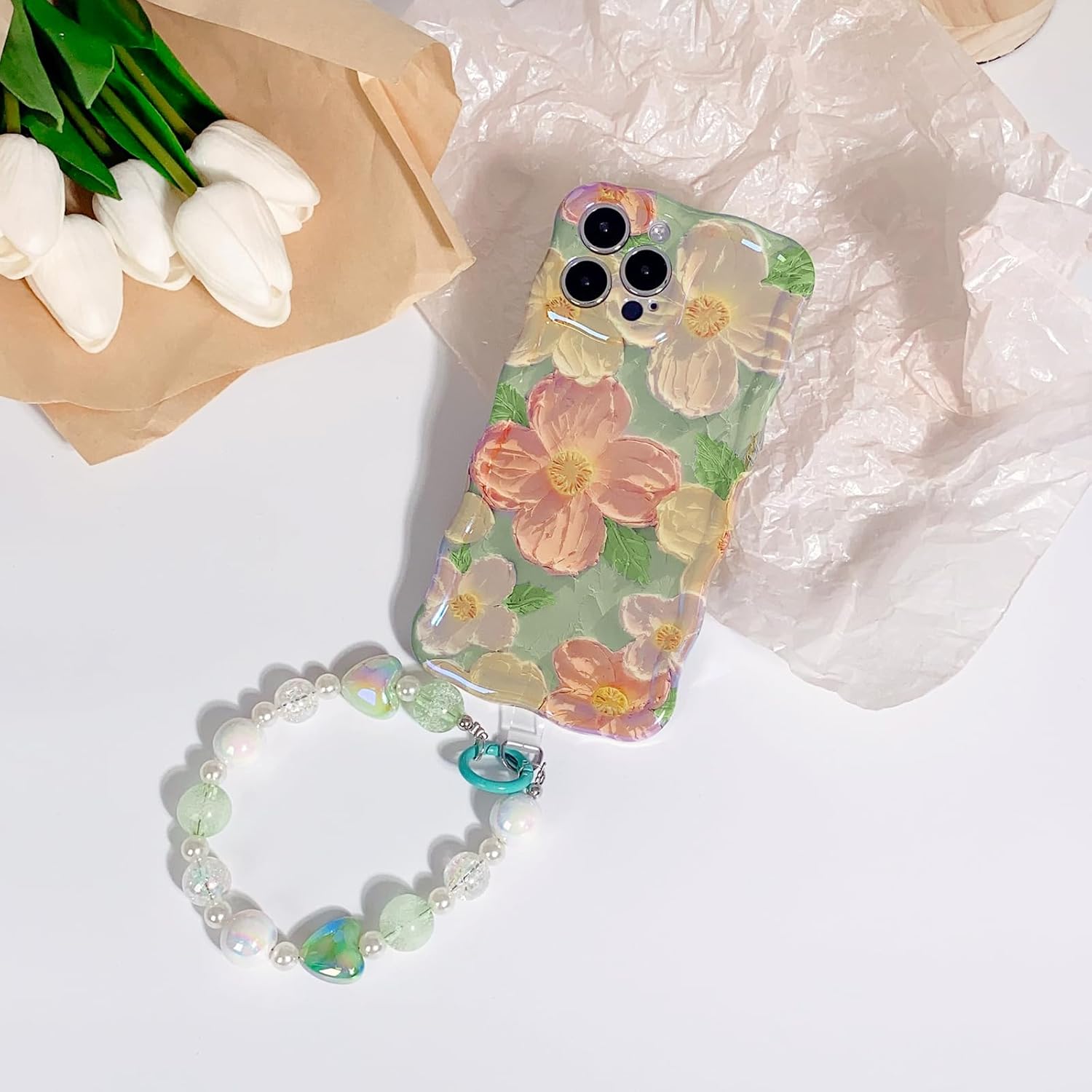 NITITOP Funda compatible con iPhone 13 Pro Max, bonita funda de pulsera con flores de aceite y correa de muñeca con cordón verde para mujeres y