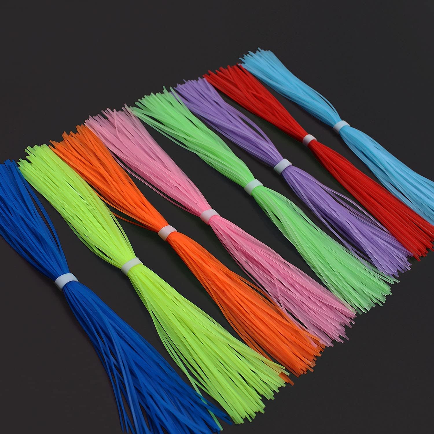 16 paquetes que brillan en la oscuridad luminosos 8 colores faldas de silicona piernas DIY cebo giratorio calamar hilo de goma materiales para atar
