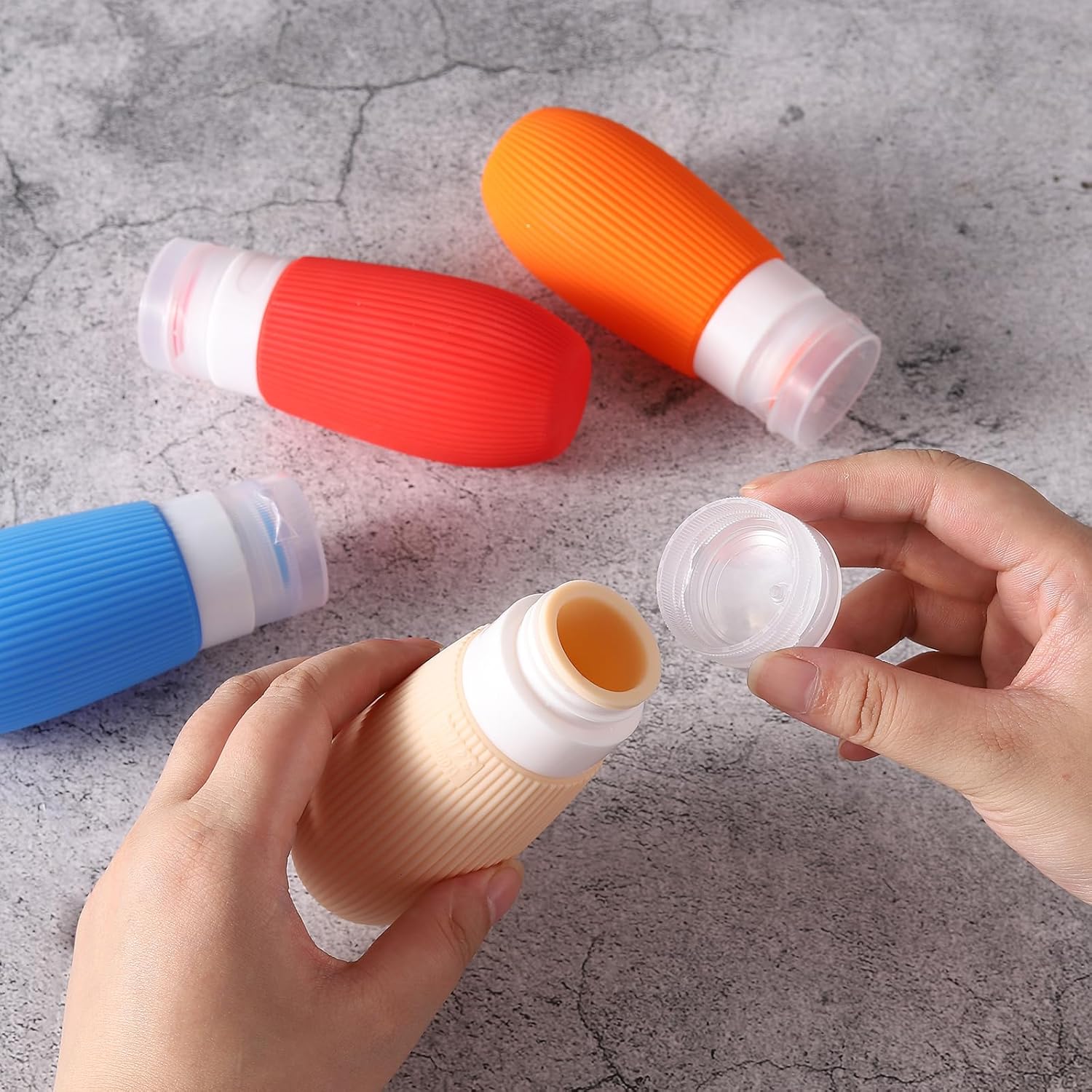 Botellas de viaje de silicona exprimibles aprobadas por la TSA de 3.4 onzas, a prueba de fugas, recipientes sin BPA para champú, acondicionador,