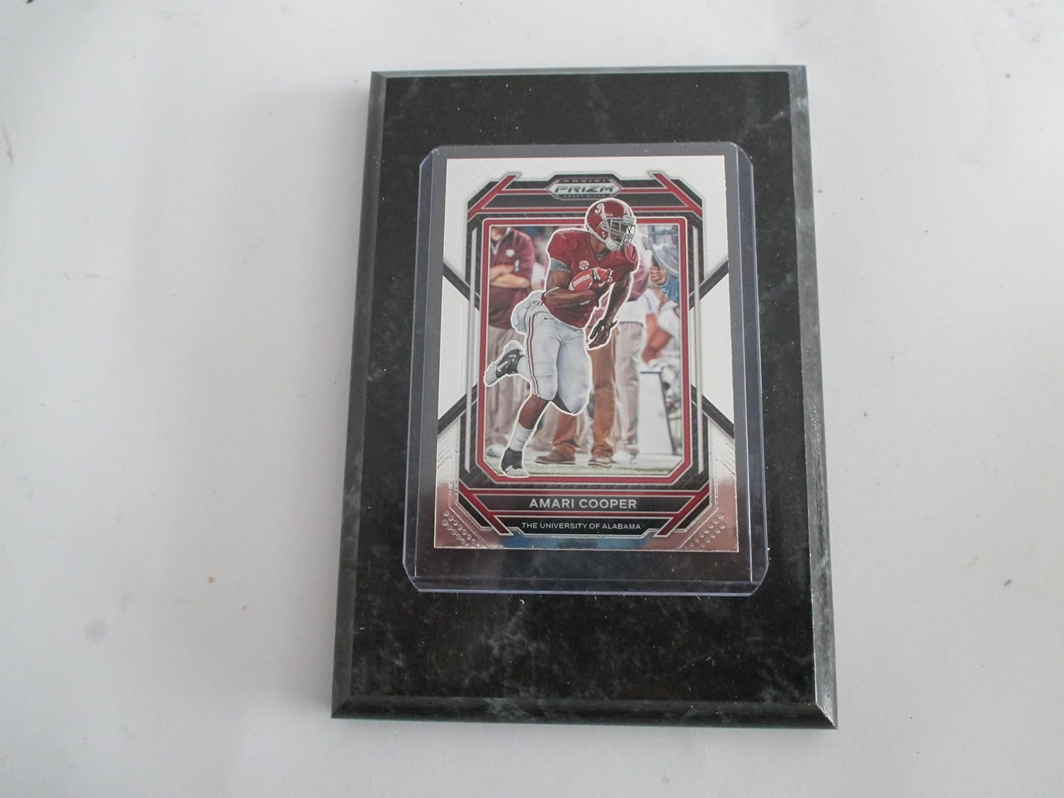 AMARI COOPER THE UNIVERSITY OF ALABAMA 2023 PRIZM DRAFT PICKS PLAYER CARD MOUNTED ON A 4″ X 6″ BLACK MARBLE PLAQUE
