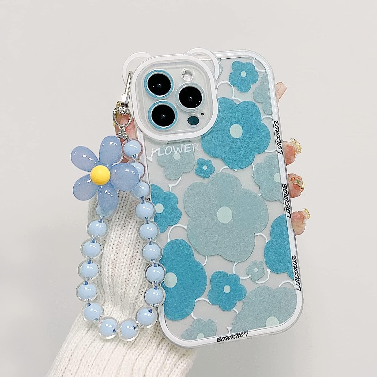 NITITOP Funda compatible con iPhone 12 Pro Max con bonita pulsera de flores, funda transparente para lente de cámara de oso floral para mujeres y