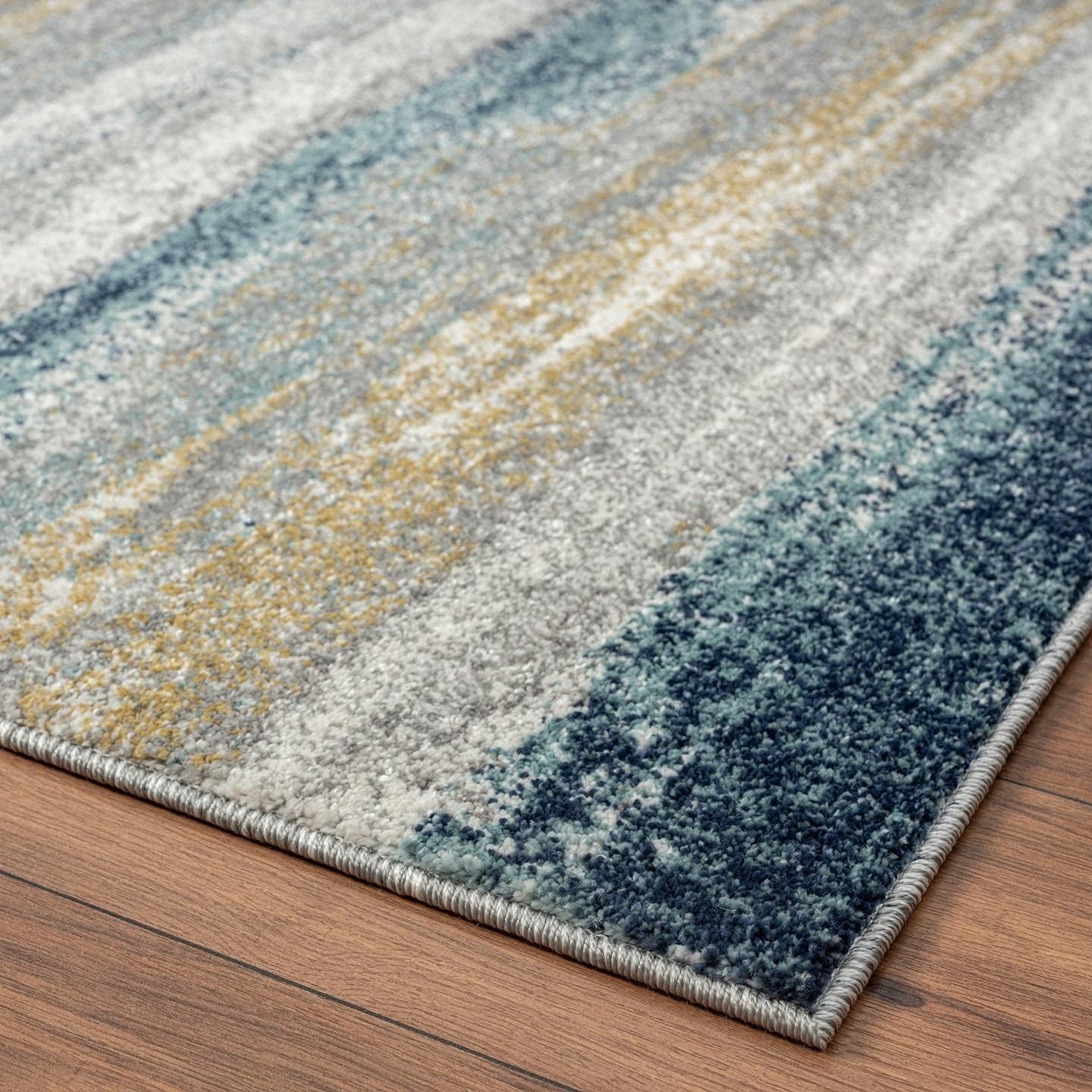 LUXE WEAVERS Alfombra moderna resistente a las manchas, color amarillo y azul, tamaño 9 x 12