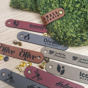 Customized 2.5 x 0.5 in Faux Leather Product Tags With Rivets Personalized Tags for Knitting and Crochet, Cute Labels Handmade Perfect for Hats Customized 2.5 x 0.5 in Faux Leather Product Tags With Rivets Personalized Tags for Knitting and Crochet, Cute Labels Handmade Perfect for Hats