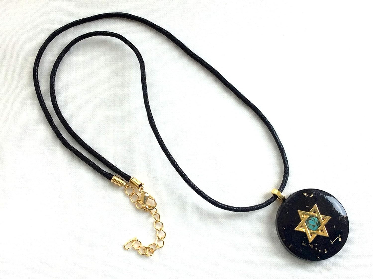 Orgone pendant necklace with golden Star of David, Turquoise & Black Tourmaline stones. Made in USA