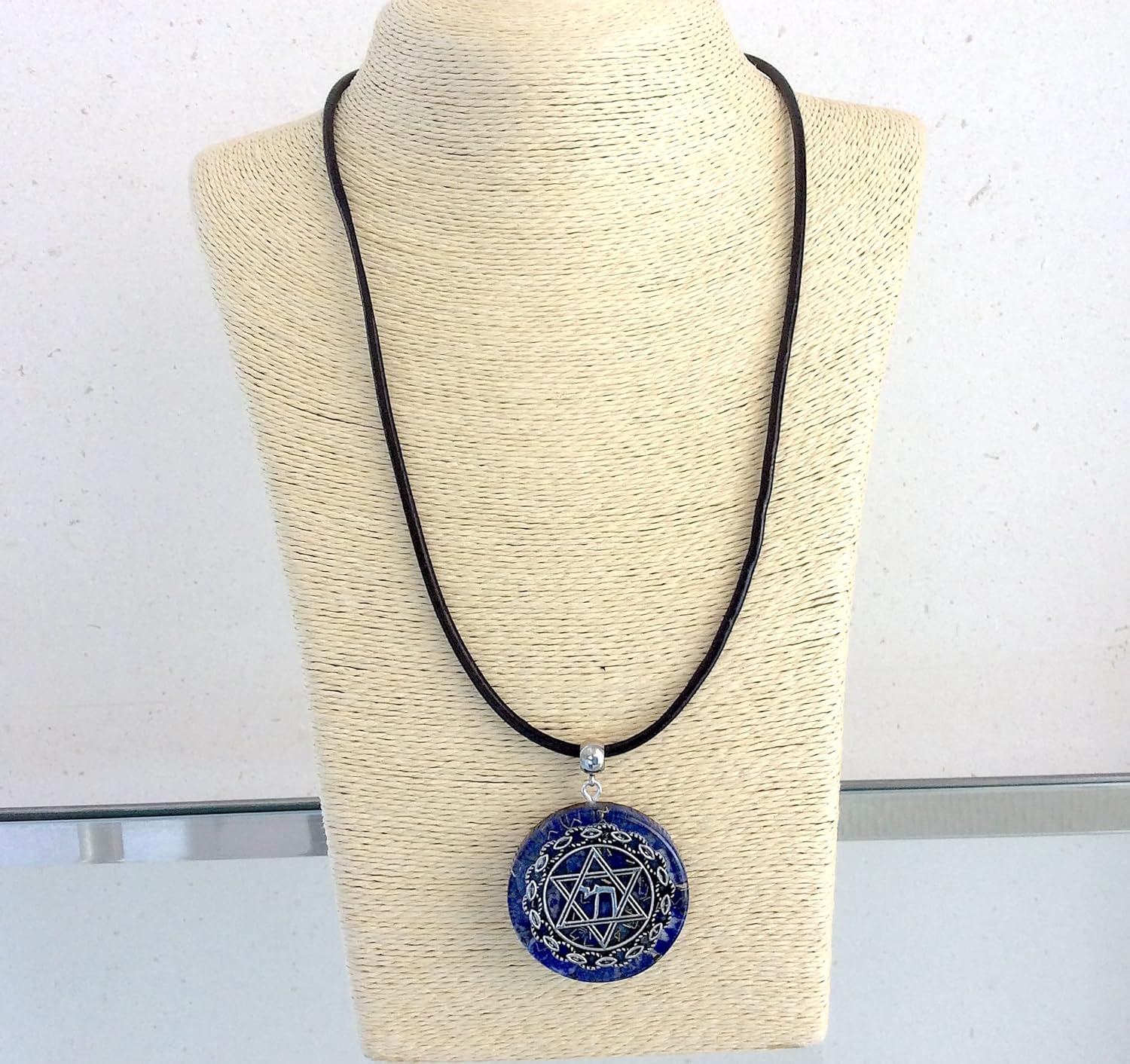 Orgone energy pendant necklace with Star of David Chai and Authentic Lapis Lazuli stones. 1.6 inch diameter. Made in USA