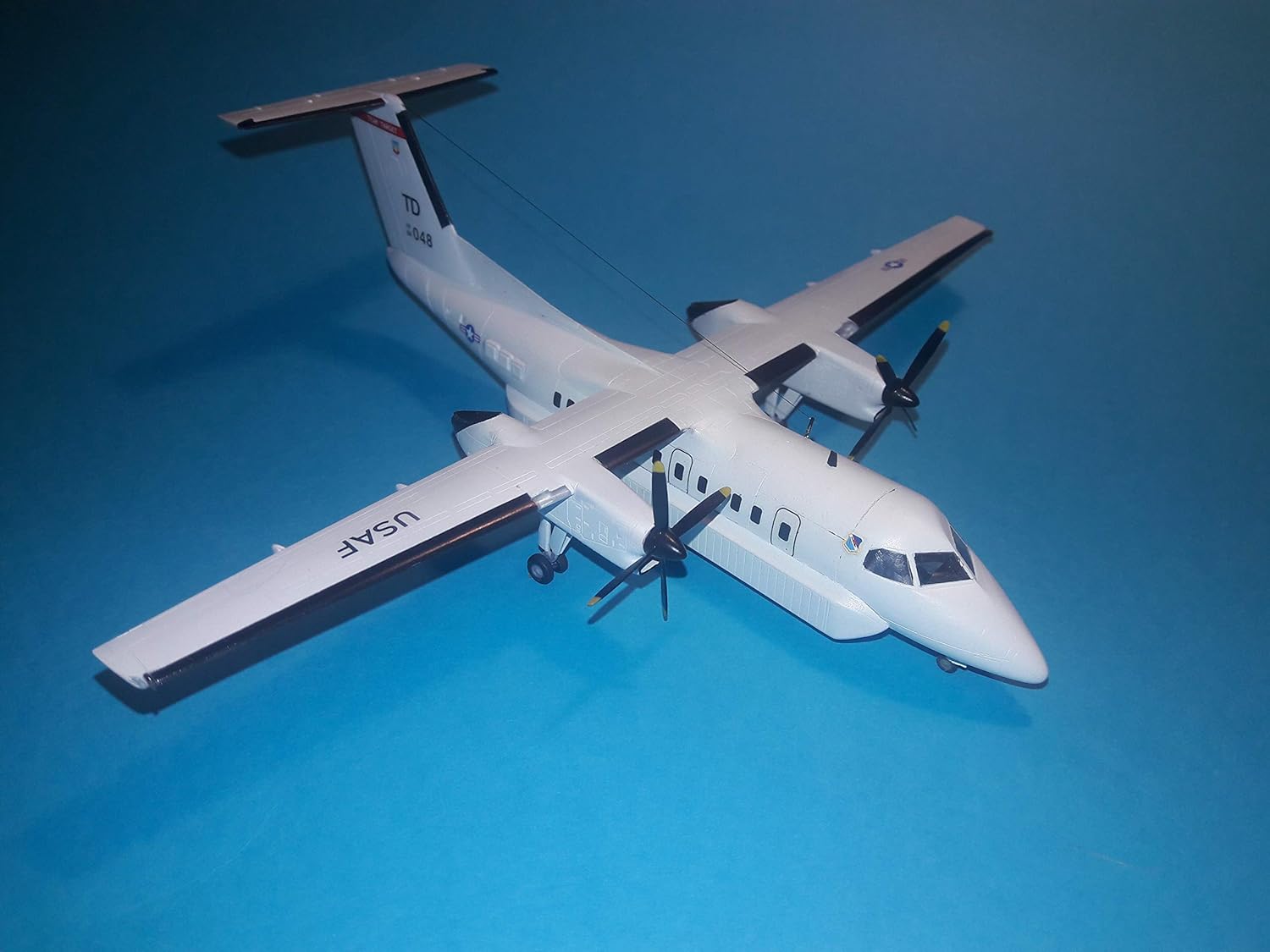 AMP 144-003 – 1144 – E-9A Widget DHC-8-106 Dash 8 Caribbean Coast Guard Model