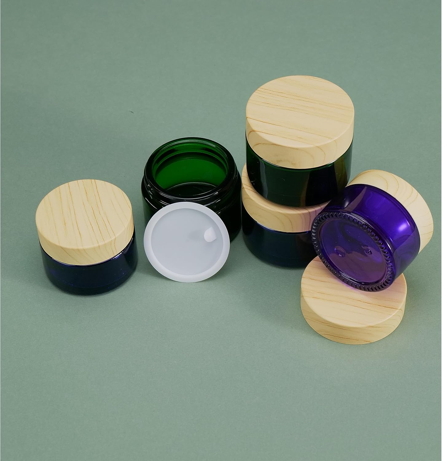 Paquete de 4 tarros de vidrio azul de 1.76 oz con tapas, tarros de crema recargable, tarros de crema cosmética, recipientes vacíos redondos para