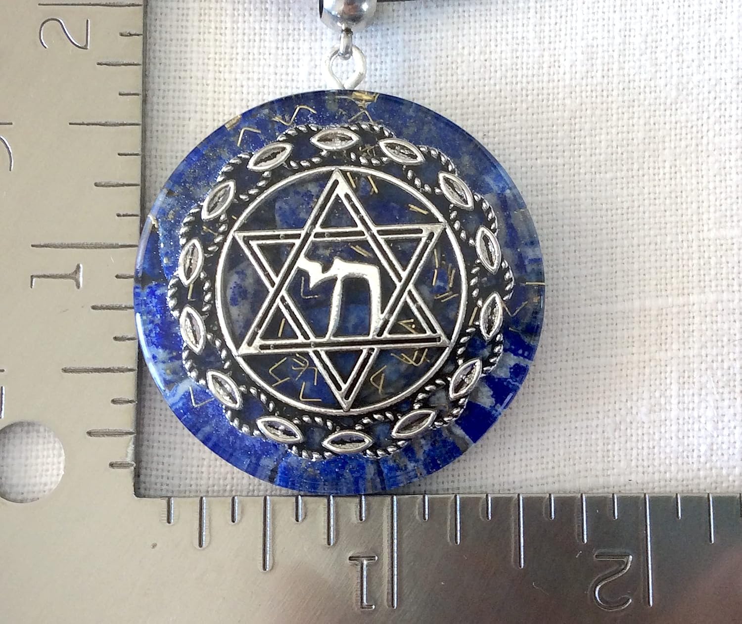 Orgone energy pendant necklace with Star of David Chai and Authentic Lapis Lazuli stones. 1.6 inch diameter. Made in USA