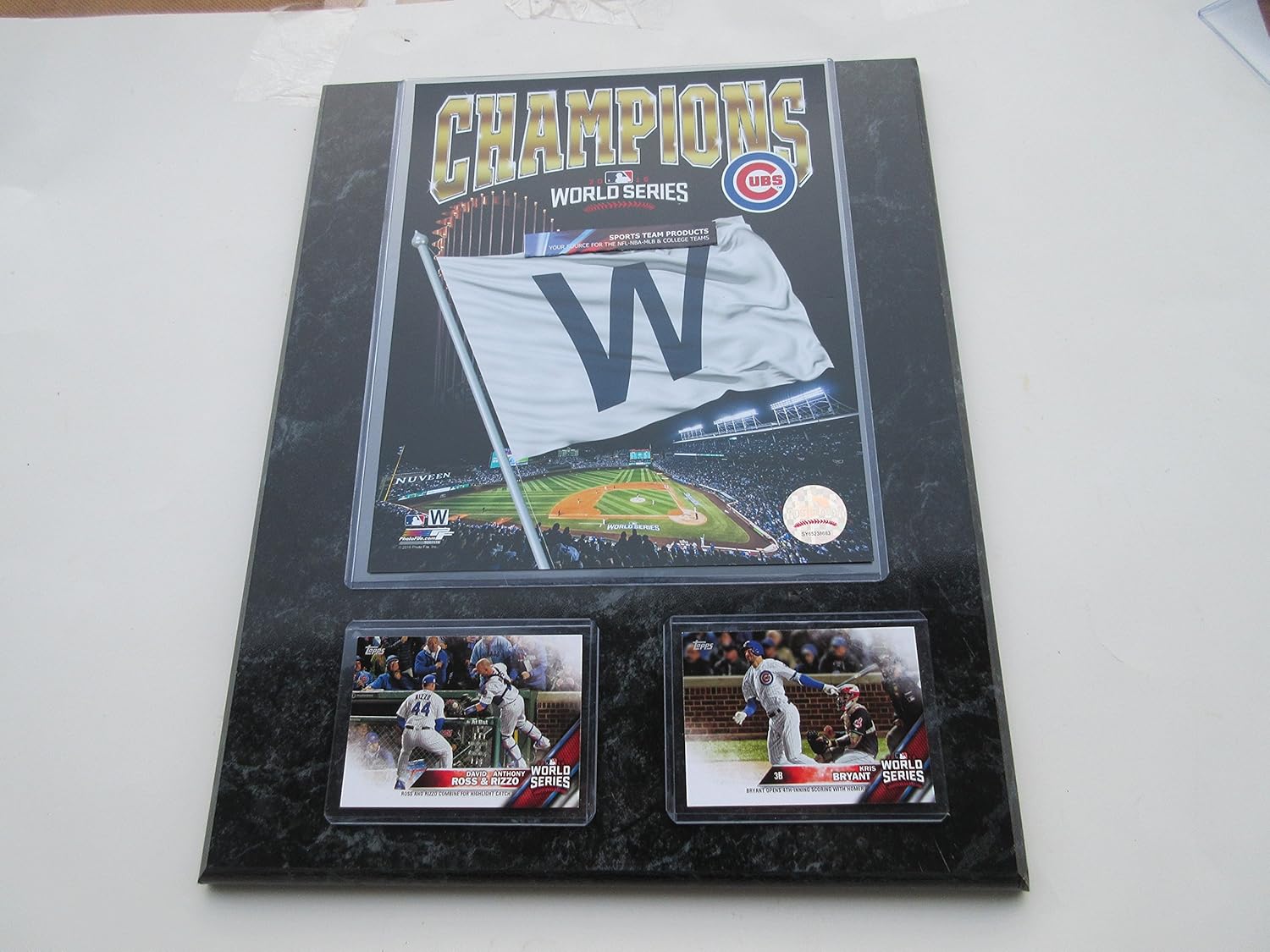 CUBS CHAMPIONS 2016 WORLD SERIES W FLAG FLIES OVER WRIGLEY FIELD PHOTO & 2 CUBS CARDS MOUNTED ON A BLACK MARBLE PLAQUE