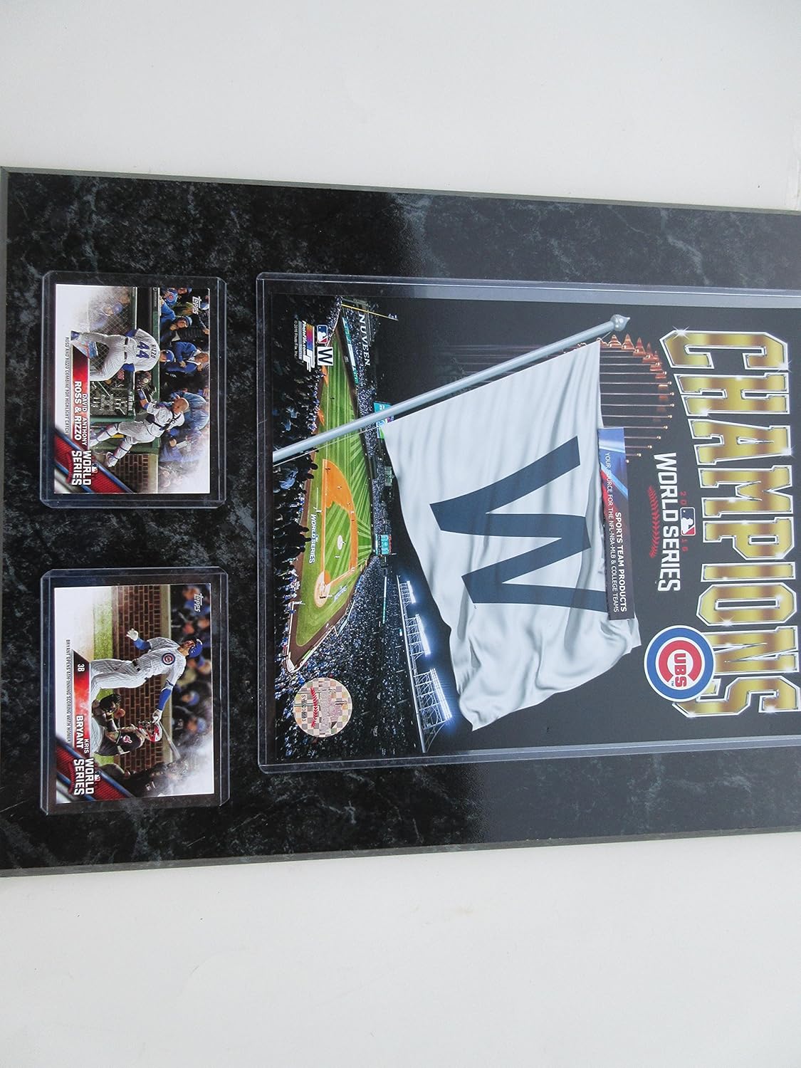 CUBS CHAMPIONS 2016 WORLD SERIES W FLAG FLIES OVER WRIGLEY FIELD PHOTO & 2 CUBS CARDS MOUNTED ON A BLACK MARBLE PLAQUE