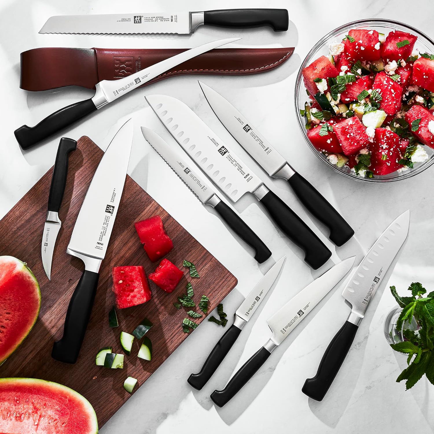 Zwilling J.A. Henckels – Santoku de 5.5 pulgadas con borde hueco de 4 estrellas
