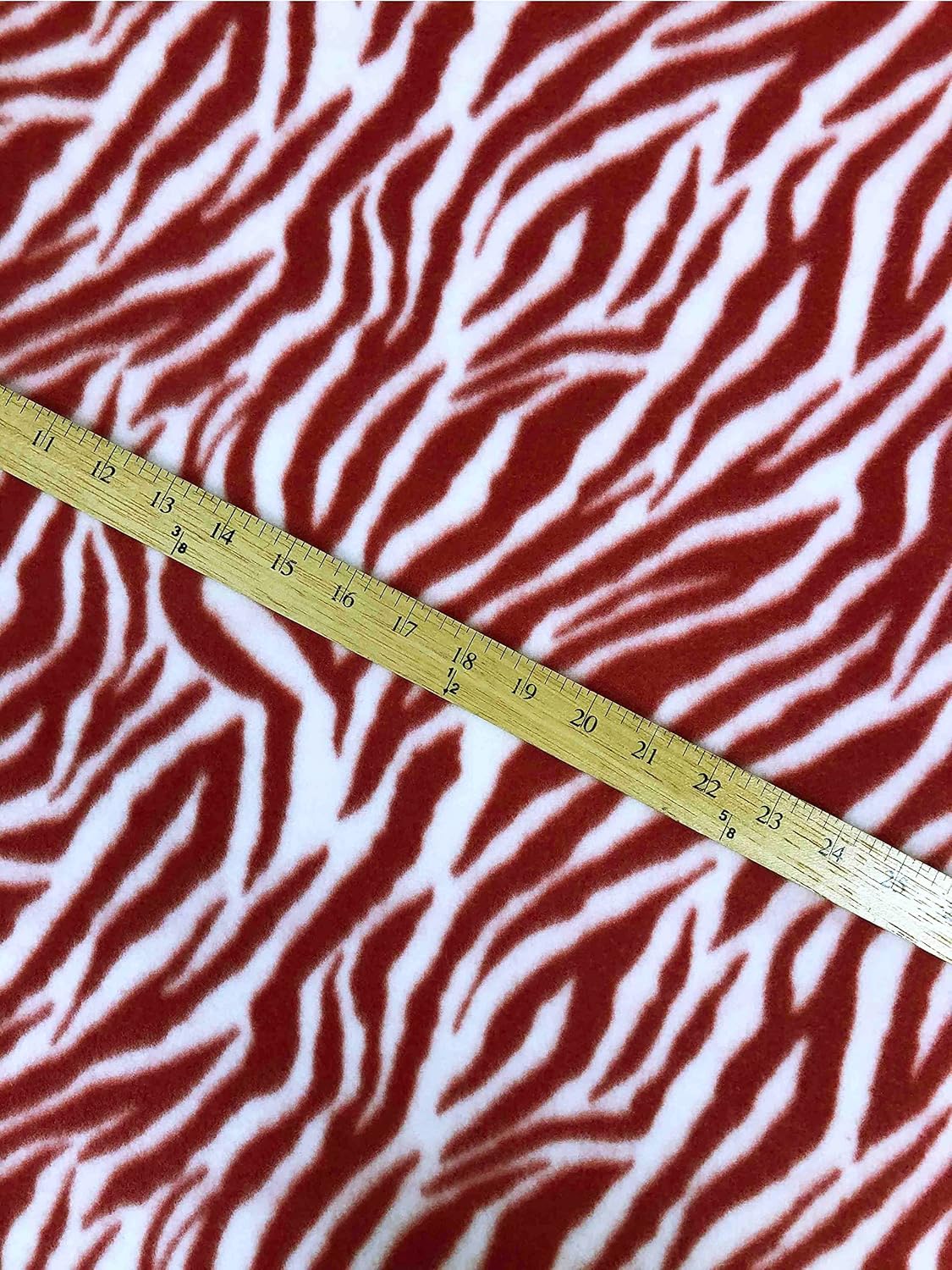 Tela polar con estampado animal rojo blanco cebra tela por The Yard