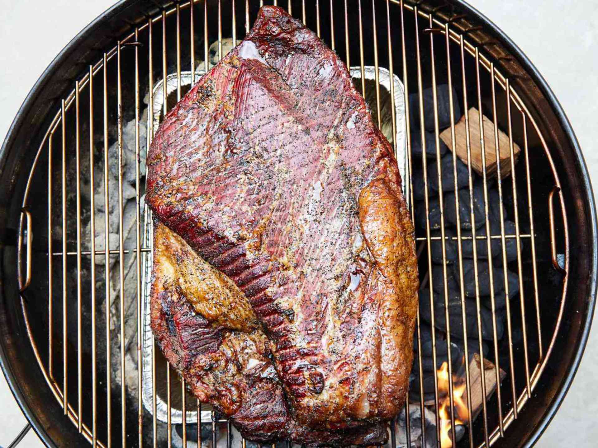 The Lazy—however Sensible—Solution to Smoke Meat on a Charcoal Grill The Lazy—however Sensible—Solution to Smoke Meat on a Charcoal Grill