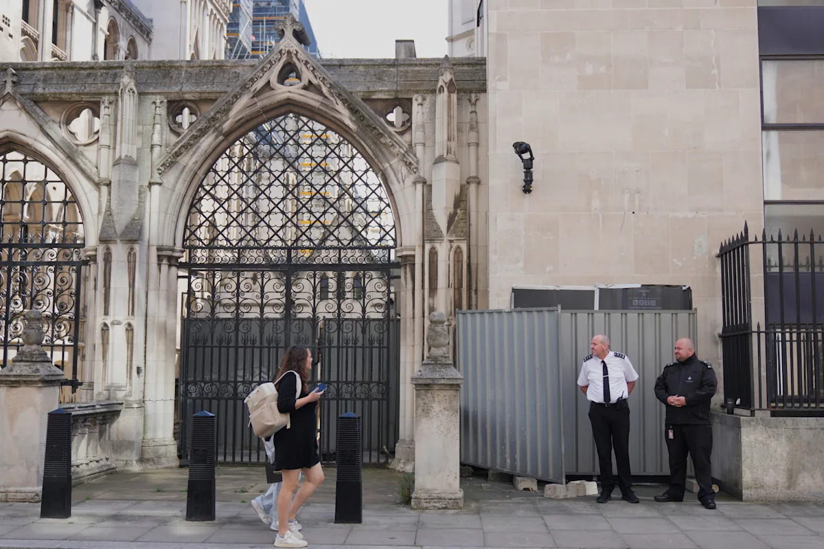 Banksy unveils a new mural of a judge beating a protester outside London court Banksy unveils a new mural of a judge beating a protester outside London court