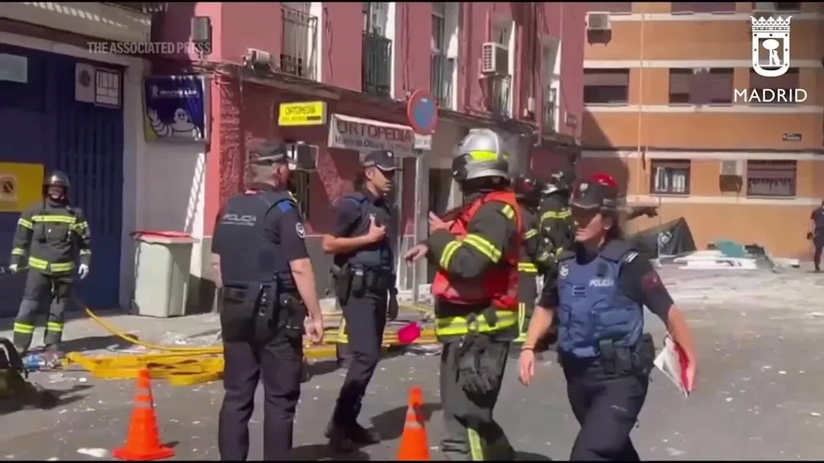 Emergency workers tend to injured after suspected gas explosion damages café in Madrid Emergency workers tend to injured after suspected gas explosion damages café in Madrid